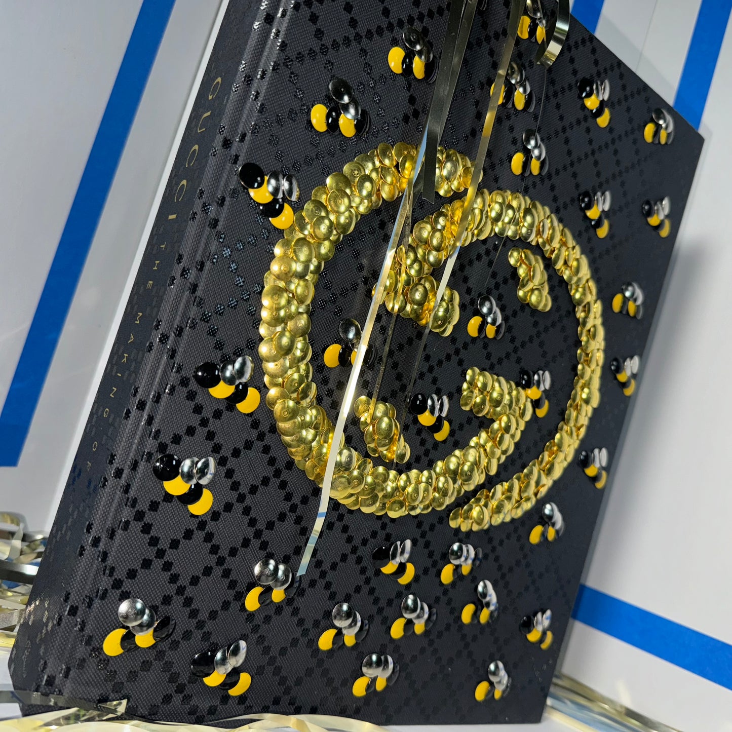 BEE Gucci man- gold gilded coffee table book by the bms.